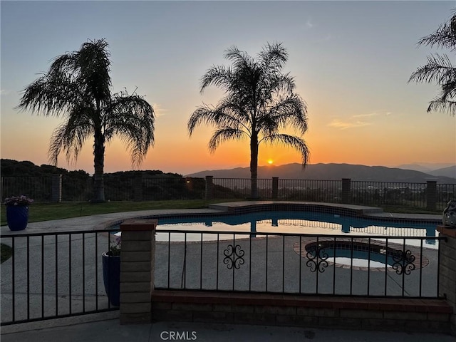11901 Sunset Ridge Dr, Yucaipa, CA 92399 - view of pool with an in-ground hot tub, a patio, and a mountain view
