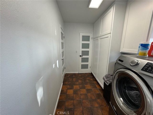11901 Sunset Ridge Dr, Yucaipa, CA 92399 - washroom with washer / clothes dryer, cabinet space, and baseboards