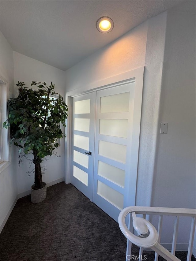 11901 Sunset Ridge Dr, Yucaipa, CA 92399 - entryway featuring french doors and dark carpet