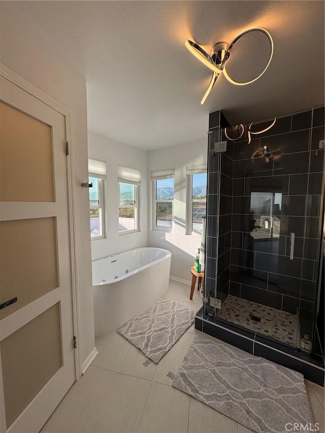 11901 Sunset Ridge Dr, Yucaipa, CA 92399 - full bathroom with a freestanding bath, a shower stall, and baseboards