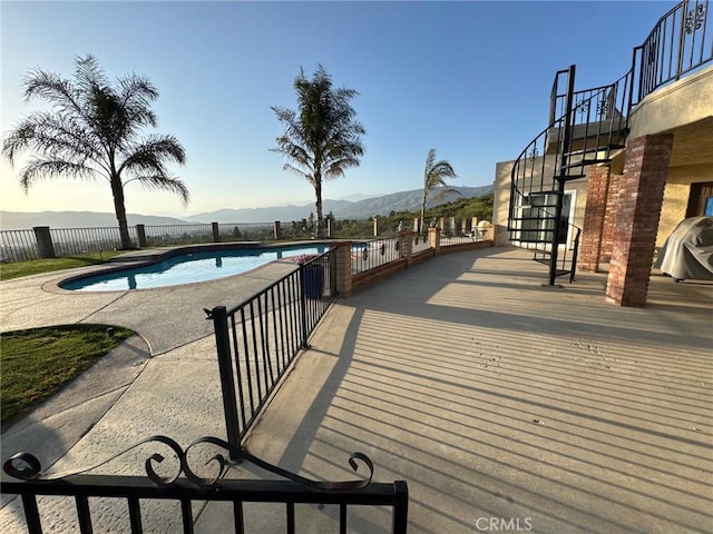 11901 Sunset Ridge Dr, Yucaipa, CA 92399 - view of swimming pool with stairway, a mountain view, and a patio area