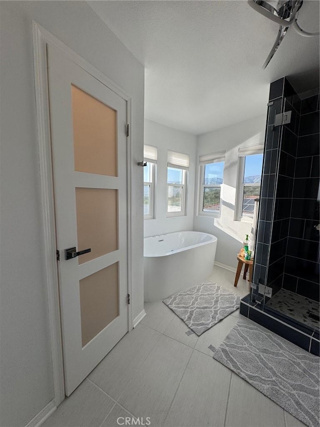 11901 Sunset Ridge Dr, Yucaipa, CA 92399 - bathroom with a freestanding tub, a shower stall, and baseboards