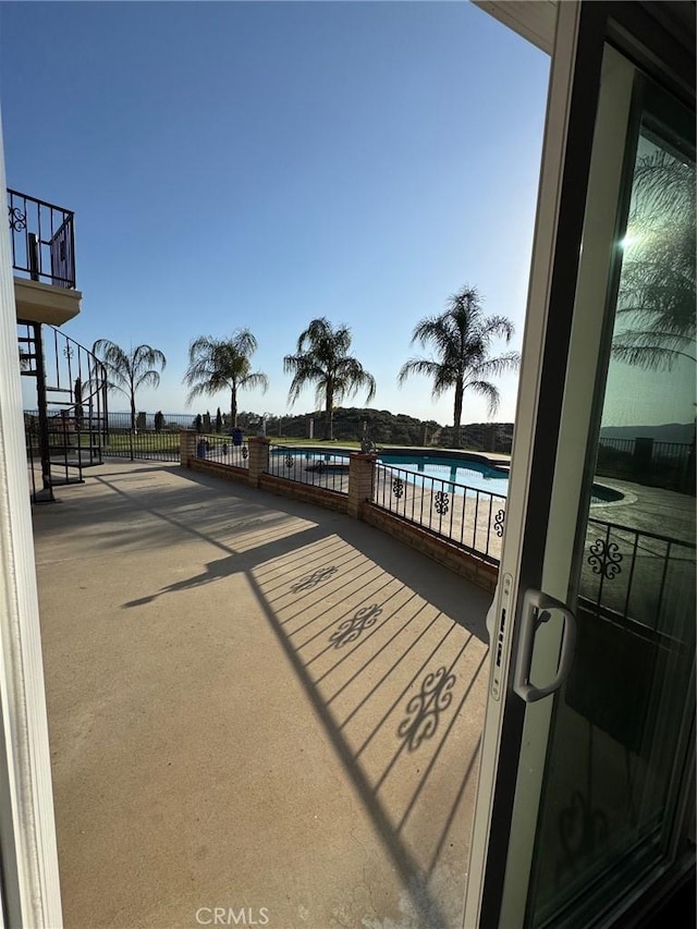 11901 Sunset Ridge Dr, Yucaipa, CA 92399 - view of patio / terrace with a community pool