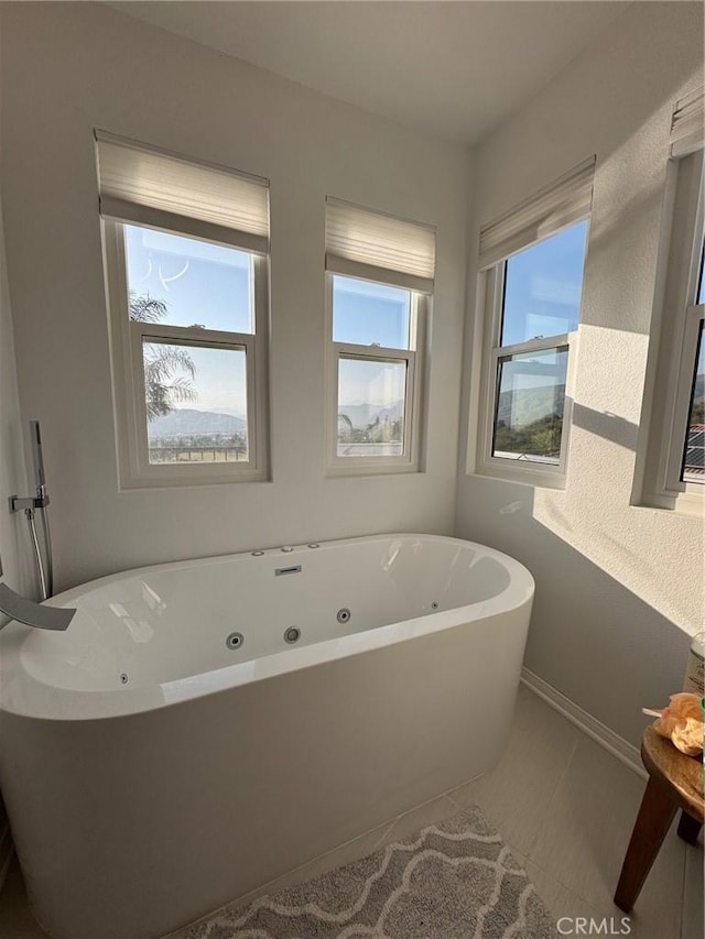 11901 Sunset Ridge Dr, Yucaipa, CA 92399 - bathroom with a soaking tub and baseboards