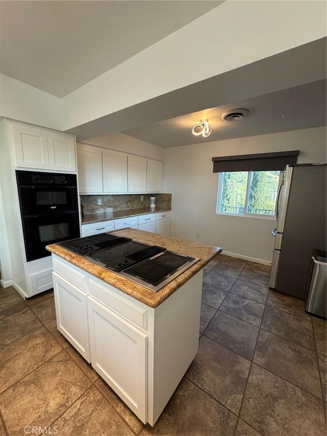 11901 Sunset Ridge Dr, Yucaipa, CA 92399 - kitchen with black appliances, white cabinets, baseboards, and backsplash