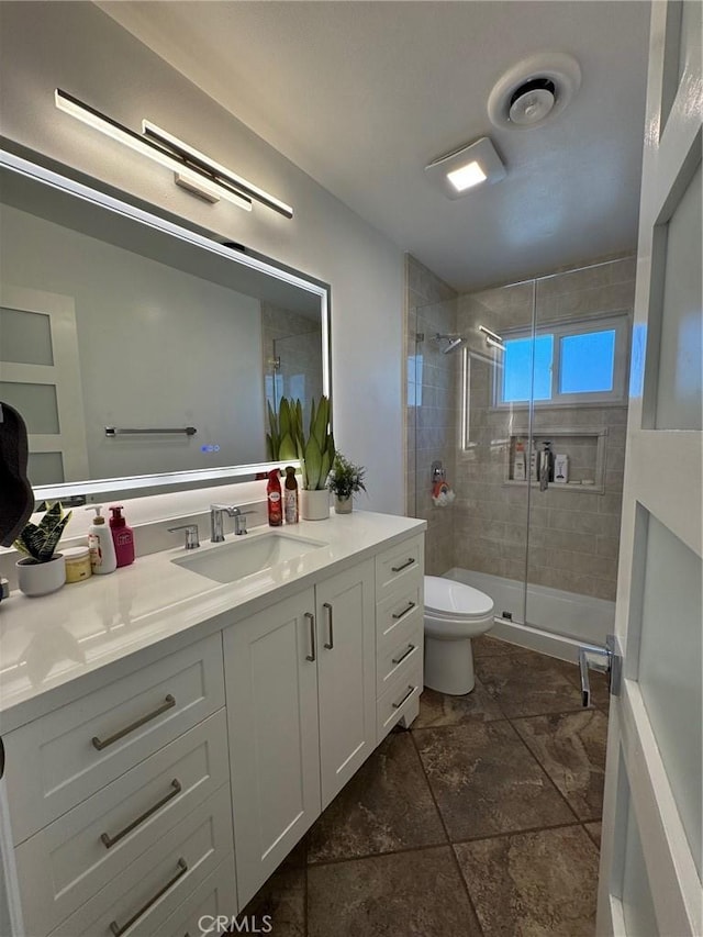 11901 Sunset Ridge Dr, Yucaipa, CA 92399 - full bath featuring vanity, a shower stall, toilet, and stone finish flooring