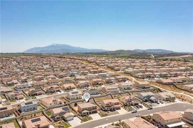 birds eye view of property with a residential view and a mountain view