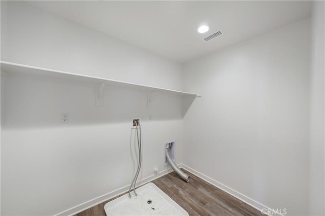 washroom featuring baseboards, visible vents, laundry area, hookup for a washing machine, and dark wood finished floors
