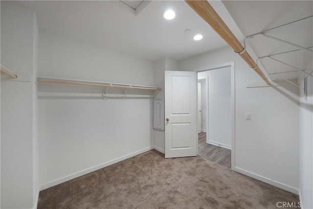 walk in closet with carpet