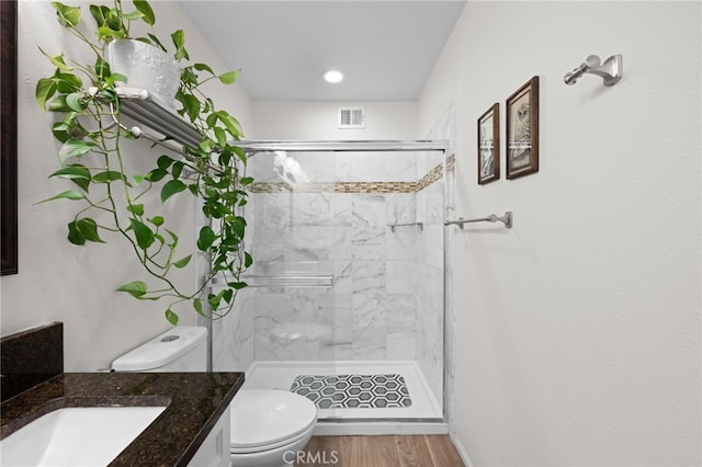 29423 Pebble Beach Dr, Menifee, CA 92586 - full bathroom featuring vanity, a stall shower, and wood finished floors