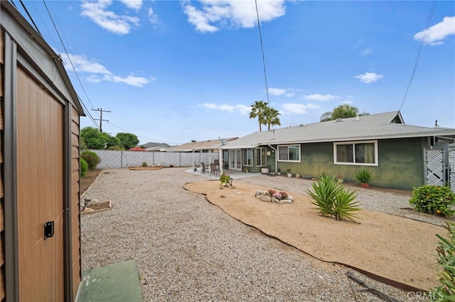 29423 Pebble Beach Dr, Menifee, CA 92586 - rear view of property featuring a fenced backyard, a patio, and stucco siding