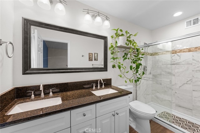 29423 Pebble Beach Dr, Menifee, CA 92586 - full bath with a stall shower, double vanity, and wood finished floors