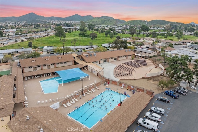 29423 Pebble Beach Dr, Menifee, CA 92586 - aerial view at dusk of a mountain view and view of pool area
