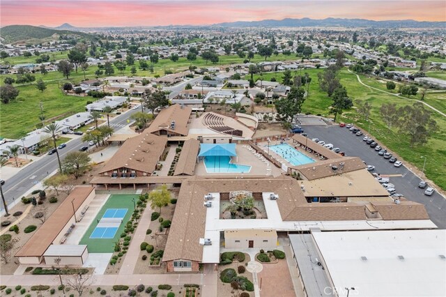 29423 Pebble Beach Dr, Menifee, CA 92586 - aerial view at dusk of a mountain view and view of pool area