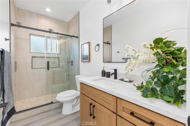 8491 Emerado Pl, Westminster, CA 92683 - bathroom with a shower stall, toilet, vanity, and wood finished floors