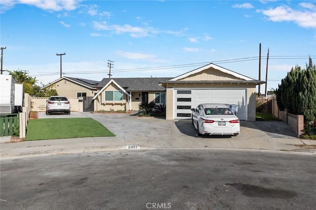 8491 Emerado Pl, Westminster, CA 92683 - ranch-style home featuring roof mounted solar panels, fence, stucco siding, a detached garage, and a front yard