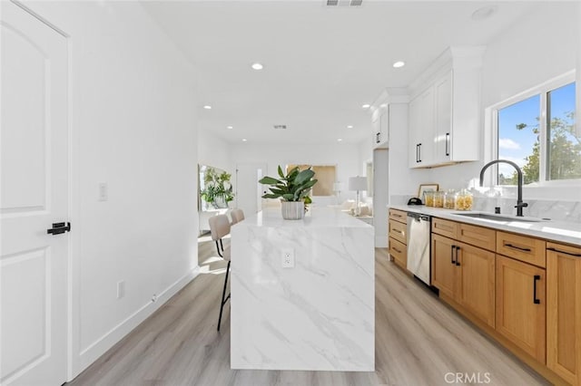 8491 Emerado Pl, Westminster, CA 92683 - kitchen featuring recessed lighting, dishwasher, light wood-style flooring, and a sink