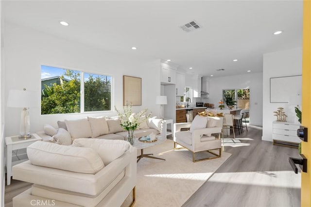 8491 Emerado Pl, Westminster, CA 92683 - living room with recessed lighting, visible vents, and light wood finished floors
