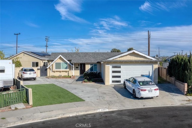 8491 Emerado Pl, Westminster, CA 92683 - ranch-style home featuring concrete driveway, an attached garage, fence, and a front lawn