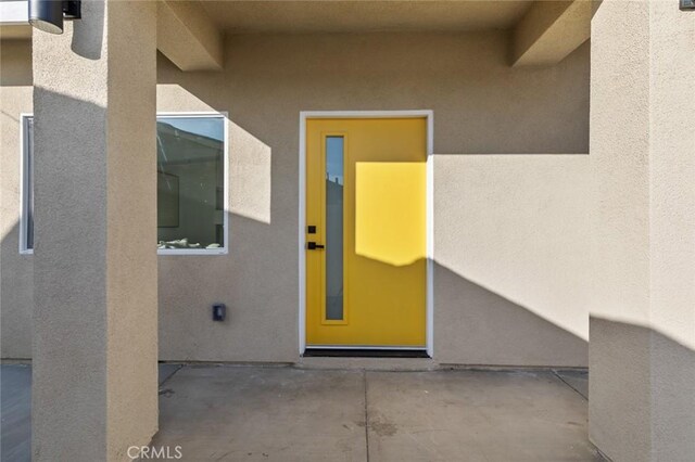 8491 Emerado Pl, Westminster, CA 92683 - property entrance featuring stucco siding and a patio area