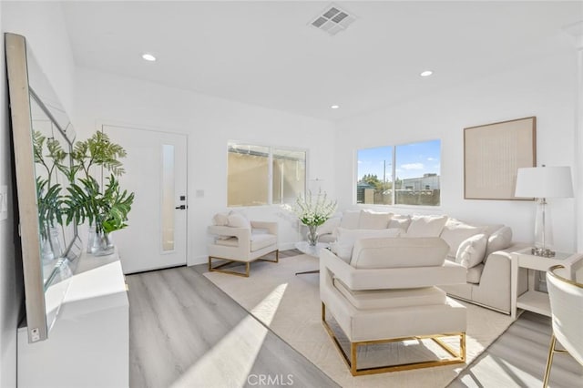 8491 Emerado Pl, Westminster, CA 92683 - living area featuring light wood-type flooring, visible vents, and recessed lighting