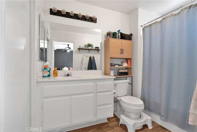 13564 Sylvan Oaks Rd, Victorville, CA 92392 - bathroom with a shower with curtain, toilet, ceiling fan, vanity, and wood finished floors
