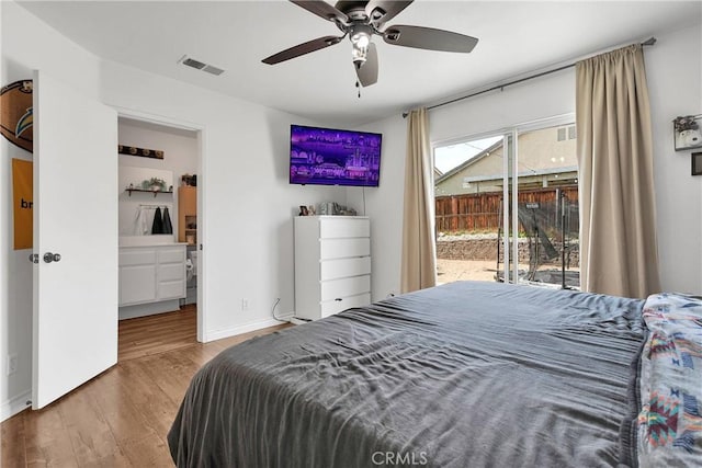 13564 Sylvan Oaks Rd, Victorville, CA 92392 - bedroom featuring access to outside, baseboards, visible vents, ceiling fan, and wood finished floors