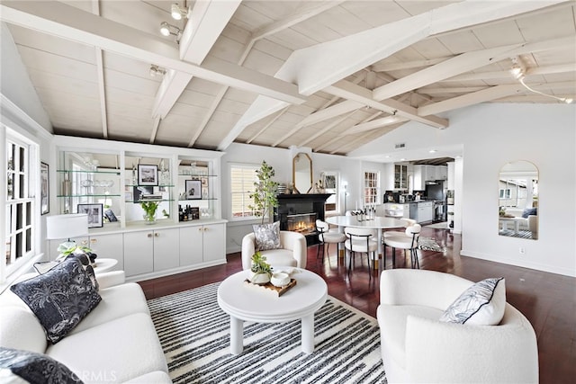 1056 Glenneyre St, Laguna Beach, CA 92651 - living area with dark wood-style floors, a glass covered fireplace, baseboards, and wood ceiling