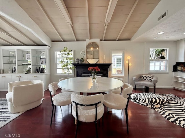 1056 Glenneyre St, Laguna Beach, CA 92651 - dining area featuring baseboards, wood finished floors, and a fireplace
