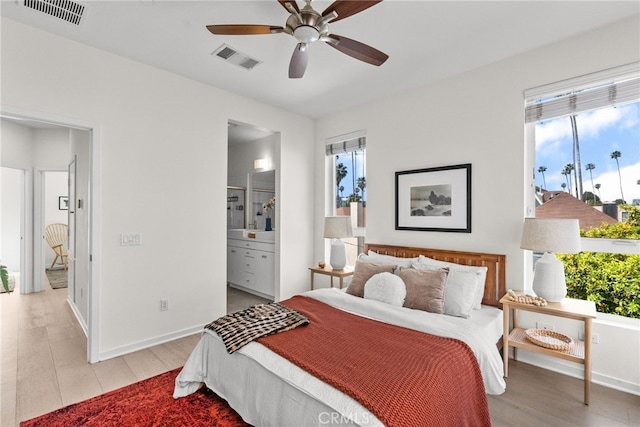 5643 Cielo Way, Los Angeles, CA 90028 - bedroom with multiple windows, light wood-style floors, and baseboards