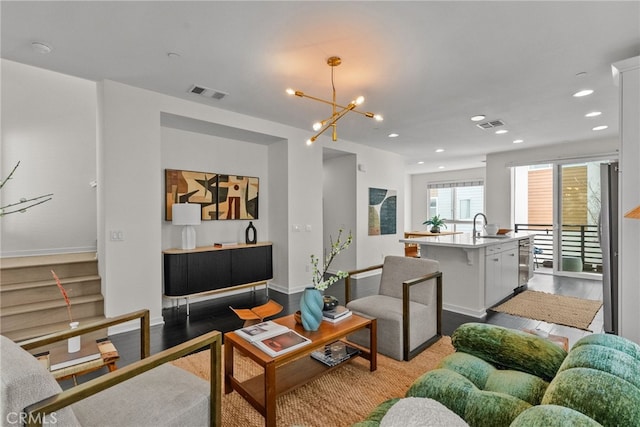 5643 Cielo Way, Los Angeles, CA 90028 - living room with a chandelier, dark wood-style flooring, and recessed lighting