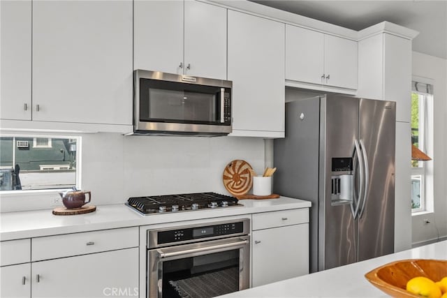 5643 Cielo Way, Los Angeles, CA 90028 - kitchen featuring appliances with stainless steel finishes, light countertops, and white cabinetry