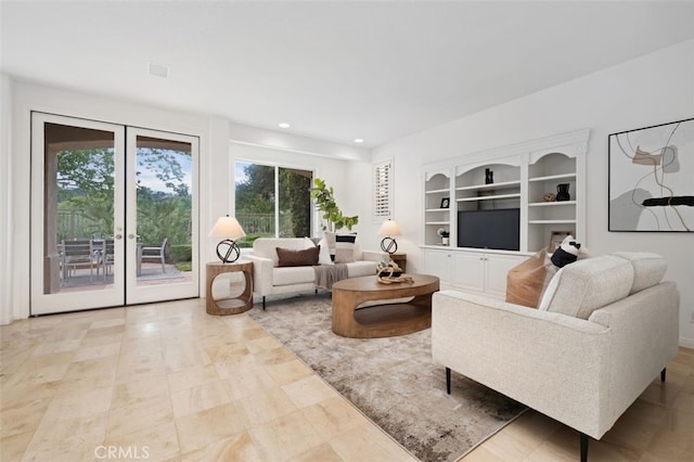 living room featuring recessed lighting, french doors, and built in features