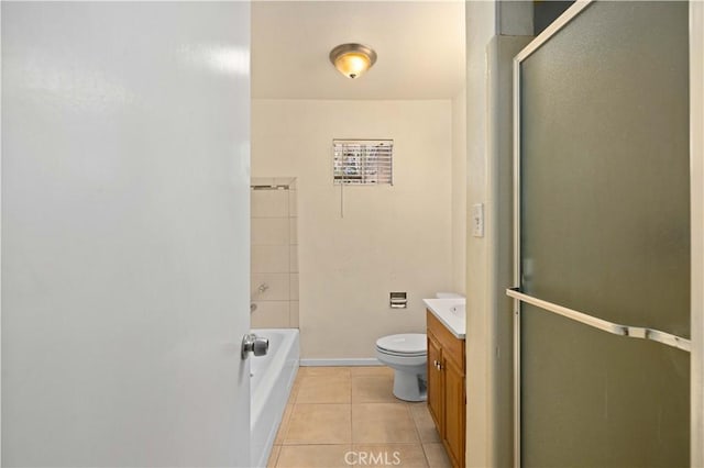 bathroom featuring toilet, vanity, tile patterned flooring, and walk in shower