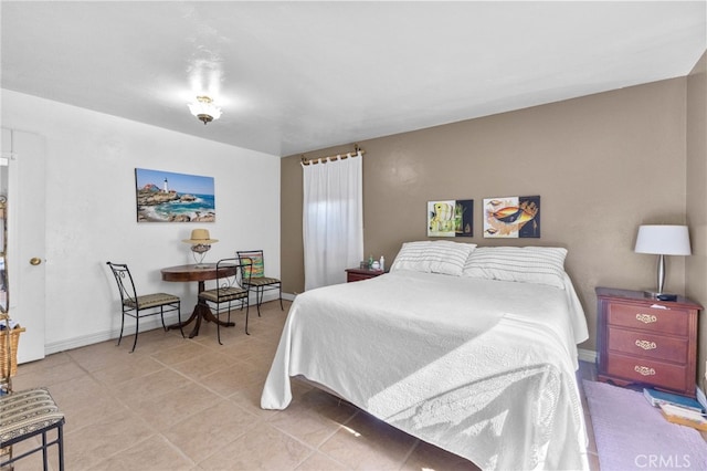 266 N 14th St, Banning, CA 92220 - bedroom featuring baseboards and light tile patterned floors