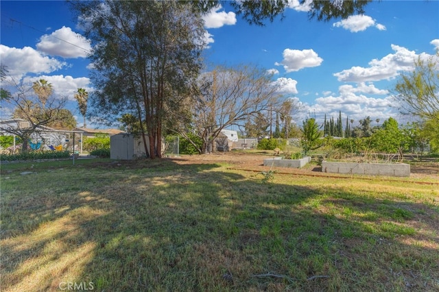 266 N 14th St, Banning, CA 92220 - view of green lawn with a vegetable garden