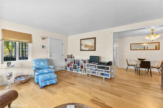 266 N 14th St, Banning, CA 92220 - living area featuring wood finished floors and a chandelier