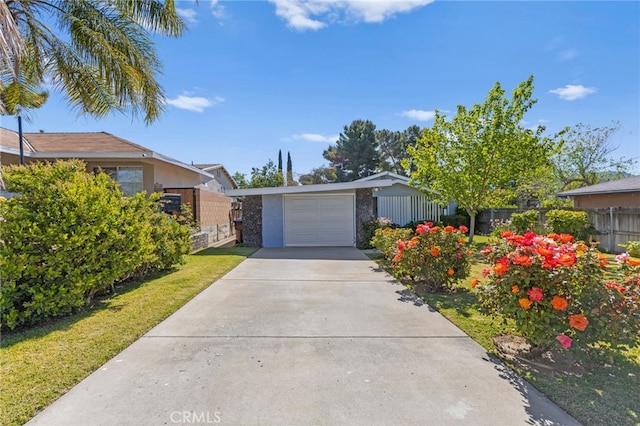 266 N 14th St, Banning, CA 92220 - view of front of home featuring a garage and concrete driveway
