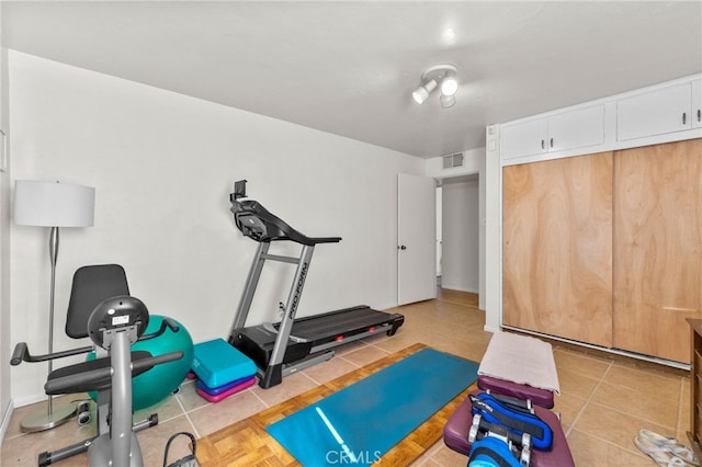 266 N 14th St, Banning, CA 92220 - exercise room featuring light tile patterned floors and baseboards
