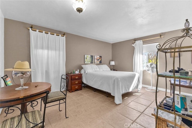 266 N 14th St, Banning, CA 92220 - bedroom with light tile patterned floors and baseboards