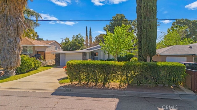 266 N 14th St, Banning, CA 92220 - view of front of property featuring a garage and concrete driveway