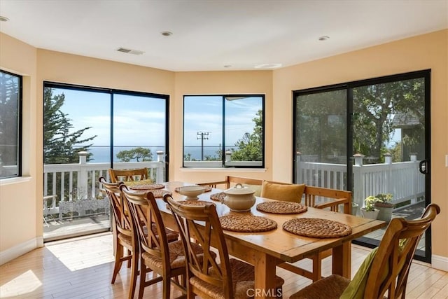 2180 Benson Ave, Cambria, CA 93428 - dining area featuring plenty of natural light, visible vents, light wood-type flooring, and baseboards