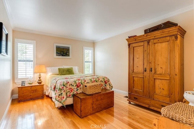 2180 Benson Ave, Cambria, CA 93428 - bedroom featuring multiple windows, light wood-type flooring, and baseboards