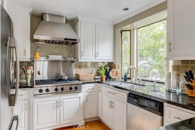 2180 Benson Ave, Cambria, CA 93428 - kitchen with a sink, white cabinetry, wall chimney exhaust hood, and stainless steel appliances
