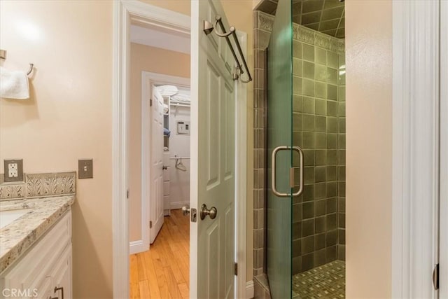 2180 Benson Ave, Cambria, CA 93428 - full bathroom with vanity, a stall shower, and wood finished floors