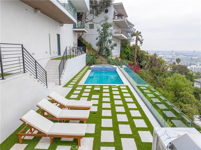 view of pool featuring a pool with connected hot tub