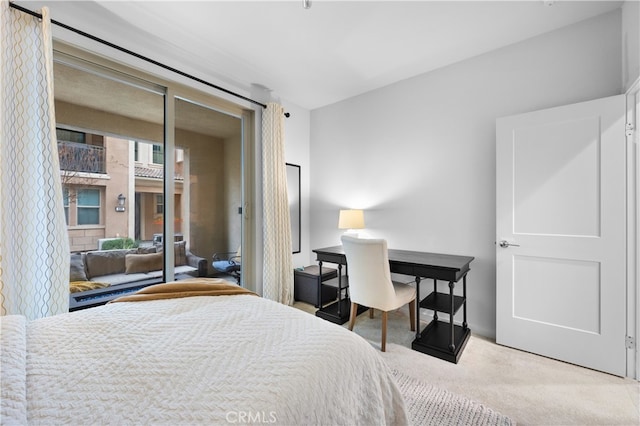 bedroom featuring access to outside and carpet
