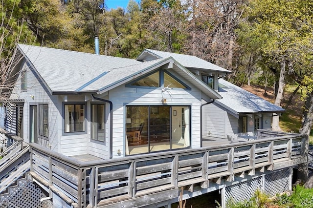 rear view of house with a wooden deck