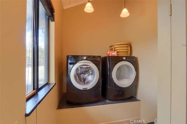 clothes washing area with washer and dryer and laundry area