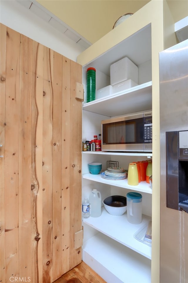 room details featuring stainless steel microwave